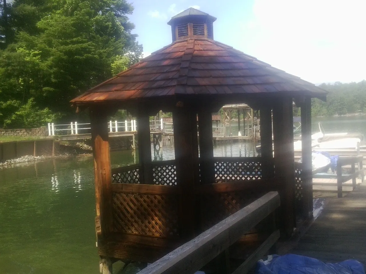 Cedar shake gazebo roof rebuilt on a lake dock in Austin